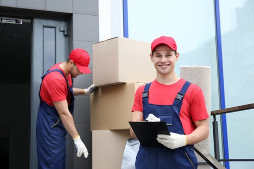Removal van and moving team in Sutton outside a residential street