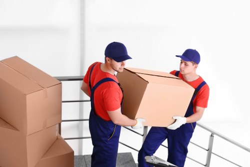Office relocation planning in Sutton with moving boxes and office furniture