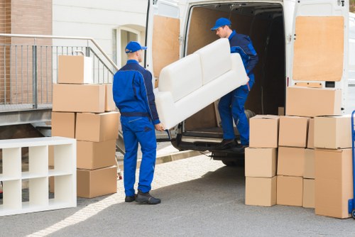 Van moving team preparing items safely before transport