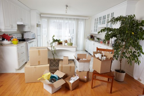 Professional movers preparing furniture for transport in Sutton