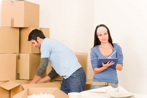 Packed boxes and furniture ready for a Sutton removal service