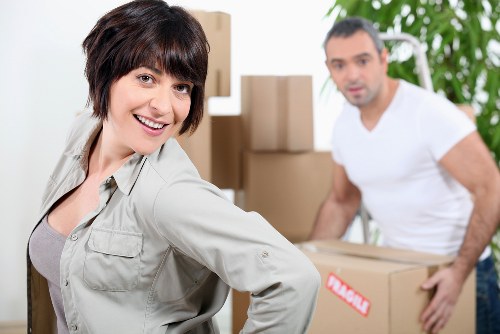 Professional office movers handling desks and equipment in Sutton
