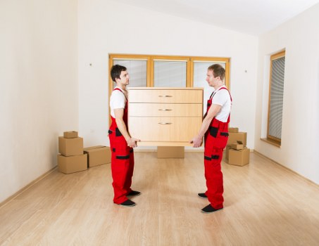 Office relocation process with labelled boxes and workspace setup